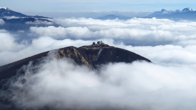 a magnificent sea of ​​clouds under the crest of the Parma Apennines