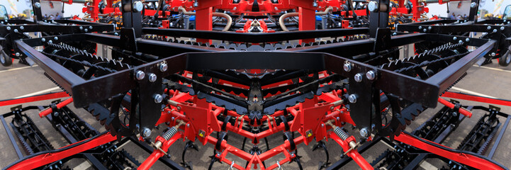 Agricultural machinery and parts of mechanisms on a sunny day. Texture, background for design. 