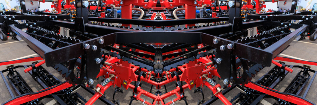 Agricultural machinery and parts of mechanisms on a sunny day. Texture, background for design. 
