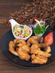 Fish fillets that are fried until golden brown and crispy, usually cut into bite-sized pieces.