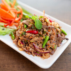 Larb Moo is a popular dish in the Northeast. It is made from minced pork seasoned with chili,...