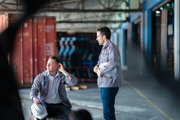 Transport operation specialists reviewing online shipping data in a large-scale warehouse. Designed...