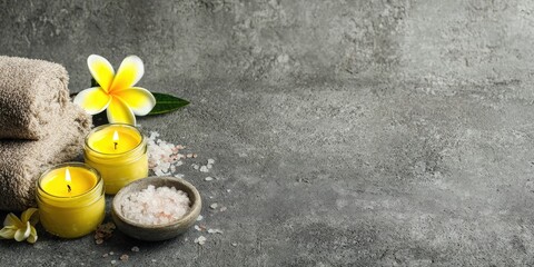 Spa still life with candles, flowers, and towels
