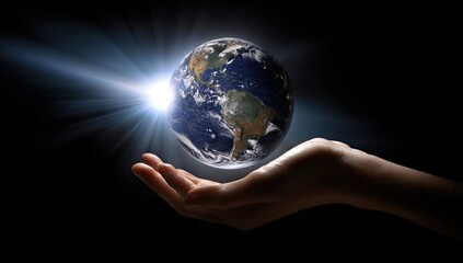 Earth held in a hand.  A digitally enhanced image