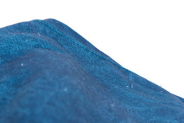 The blue fabric on the white background creates a background with a motif that has the shape of ocean waves.