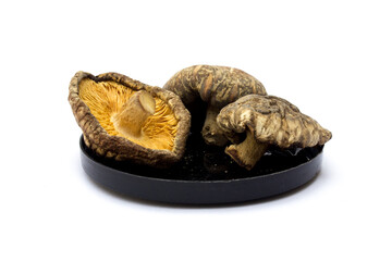 Dried shiitake mushrooms isolated on white background. They are a good source of vitamins,...