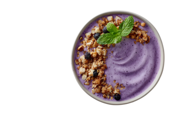 A vibrant blueberry smoothie bowl with granola, top view. The bowl is adorned with fresh mint leaves and flax seeds for an extra touch of freshness.