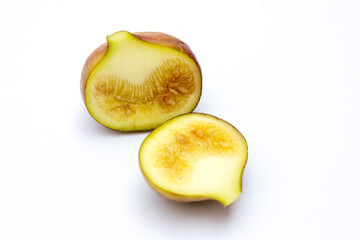 A fig on a white background. Figs contain minerals like potassium, calcium, and magnesium, which are important for maintaining healthy blood pressure, strong bones, and proper muscle function