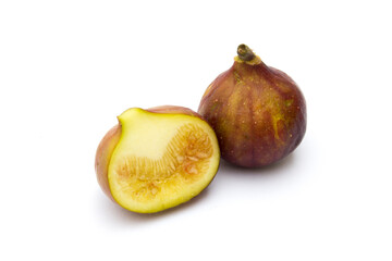 Two figs on a white background. One fruit has been split into two halves. Figs are also packed with antioxidants, which can help protect the body against cell damage and disease. 