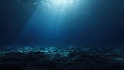 Underwater sunlight beams on dark seabed
