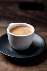 Cup of coffee on wooden background. Soft focus. Copy space	