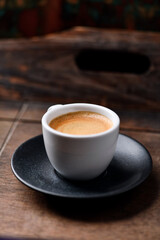 Cup of coffee on wooden background. Soft focus. Copy space	
