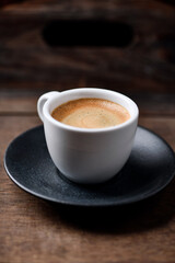 Cup of coffee on wooden background. Soft focus. Copy space	