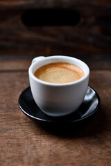 Cup of coffee on wooden background. Soft focus. Copy space	