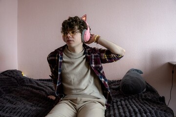 Stylish young person relaxing in a cozy room with playful decor during a peaceful afternoon