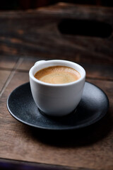 Cup of coffee on wooden background. Soft focus. Copy space	