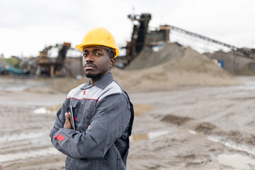Portrait worker Man african adult surveying engineer at sand quarry ore mining site