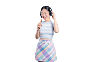 A happy young Asian woman with headphones, closing her eyes and singing along to her favorite song on her phone.
on png