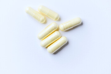 Alpha-lipoic acid capsules. Paper background. Soft focus. Close up. Copy space.	