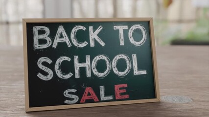 Back to school sale sign promoting discounts for students and parents in retail space - Powered by Adobe