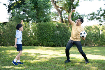 Celebrating Soccer Success: Father and Son Moment