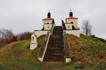 White Chapel with Sculptures and Stairs in Czech Countryside