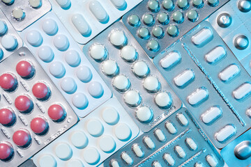 Top view of of various medicine blister packs on white background