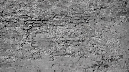 gray background, in the photo an old brick wall and gray plaster