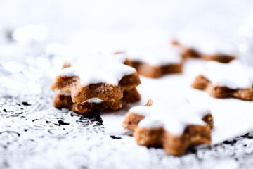 Christmas cookies (cinnamon stars) on bright background. Close up.	