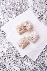 Stollen Bites on bright background. Soft focus. Close up. Copy space.	