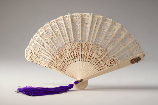 Elegant handheld fan with intricate floral cutouts, accompanied by a vibrant purple tassel for charm. - Powered by Adobe