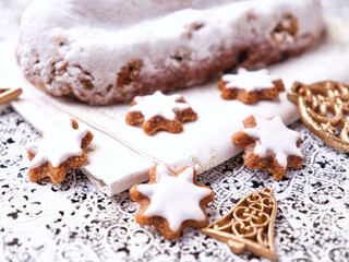 Christmas strudel with marzipan and cinnamon stars on bright background. Close up.	