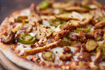 Gyros Pizza with jalapeno pepper and mozzarella cheese. Soft focus. Close up.