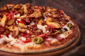 Gyros Pizza with jalapeno pepper, cherry tomatoes and mozzarella cheese. Soft focus. Close up.	