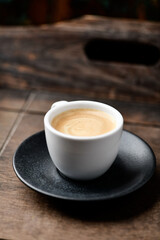 Cup of coffee on wooden background. Soft focus. Copy space	