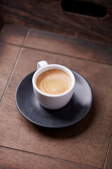 Cup of coffee on wooden background. Soft focus. Copy space	