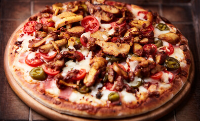 Gyros Pizza with jalapeno pepper, cherry tomatoes and mozzarella cheese. Soft focus. Close up.	
