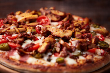 Gyros Pizza with jalapeno pepper, cherry tomatoes and mozzarella cheese. Soft focus. Close up.	