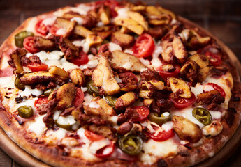 Gyros Pizza with jalapeno pepper, cherry tomatoes and mozzarella cheese. Soft focus. Close up.	
