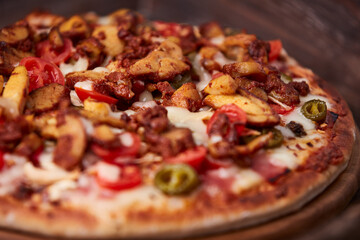 Gyros Pizza with jalapeno pepper, cherry tomatoes and mozzarella cheese. Soft focus. Close up.	