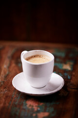 Cup of coffee on wooden background. Soft focus. Copy space	