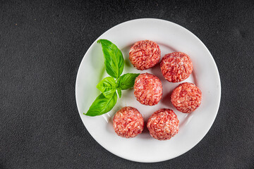 Meatballs raw meat pork, beef, chicken fresh delicious gourmet food background on the table rustic food top view copy space