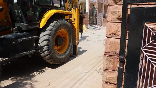 roadwork in progress with digger at construction site