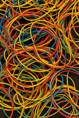 rubber bands for office or money packaging, empty scattered thin rubber bands of different colors...