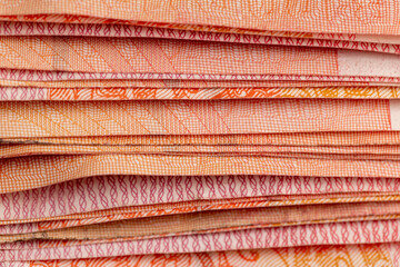 One hundred yuan Chinese money together, large-denomination Red Chinese money stacked together on...