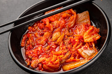 Kimchi pickled cabbage salad spicy savory vegetables fresh delicious gourmet food background on the table rustic food top view copy space vegetarian and vegan food