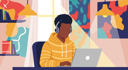 Fototapeta premium Young man working on laptop from home, perfect for illustrating remote work, online education, or freelance concepts.