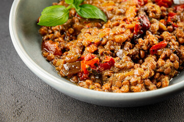 Lentil dish vegetables and roasted peppers savory vegetable fresh vegetarian and vegan food gourmet food background on the table rustic food top view copy space keto and paleo diet
