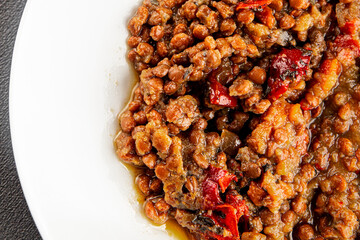 Lentil dish vegetables and roasted peppers savory vegetable fresh vegetarian and vegan food gourmet food background on the table rustic food top view copy space keto and paleo diet