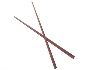 A pair of wooden chopsticks placed on a white background. Two wooden chopsticks made of wood. Wooden chopsticks are tools for eating.